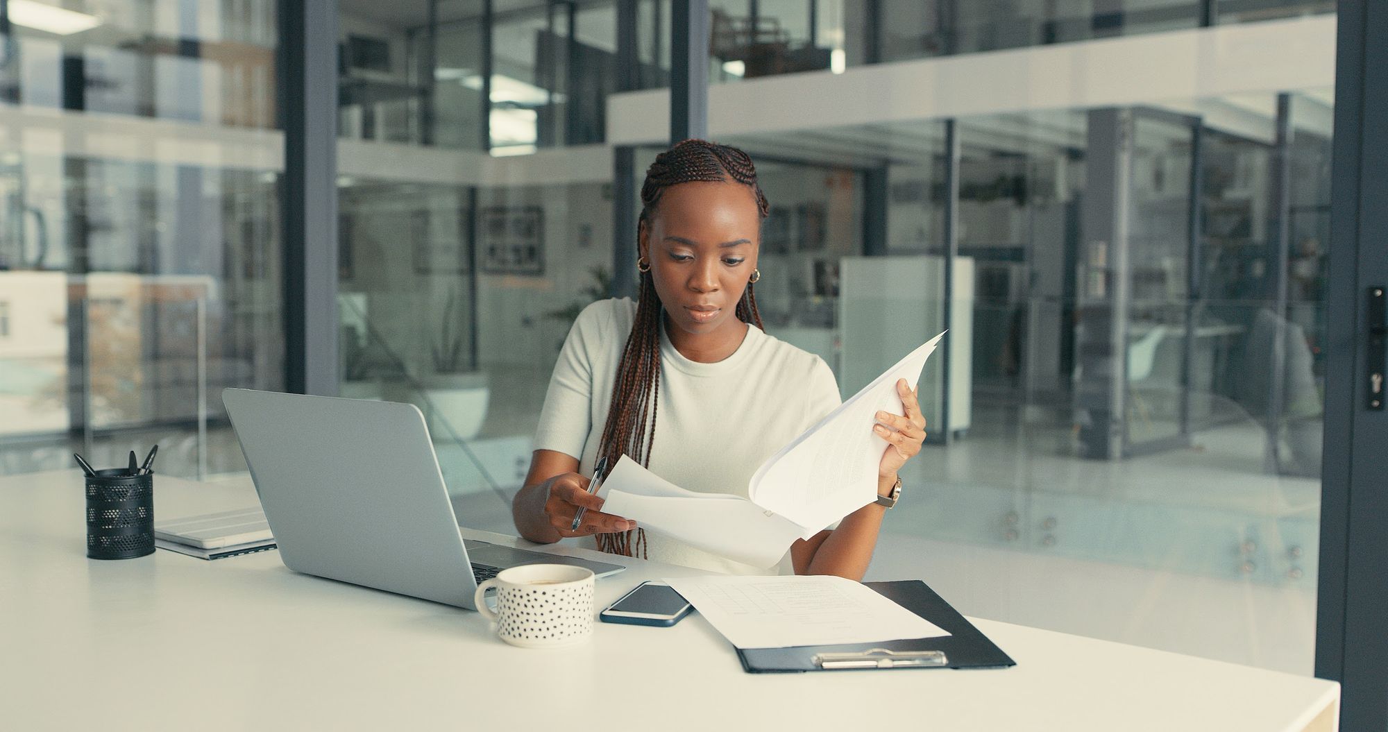 image showing young professional reviewing documents