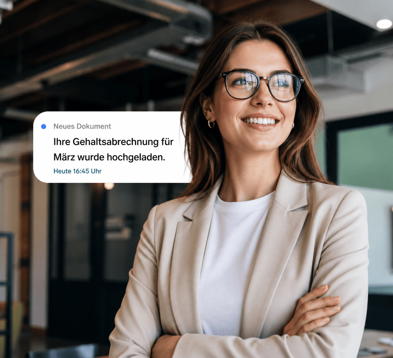 Smiling woman in an office looks at a notification: "Your payslip for March has been uploaded."