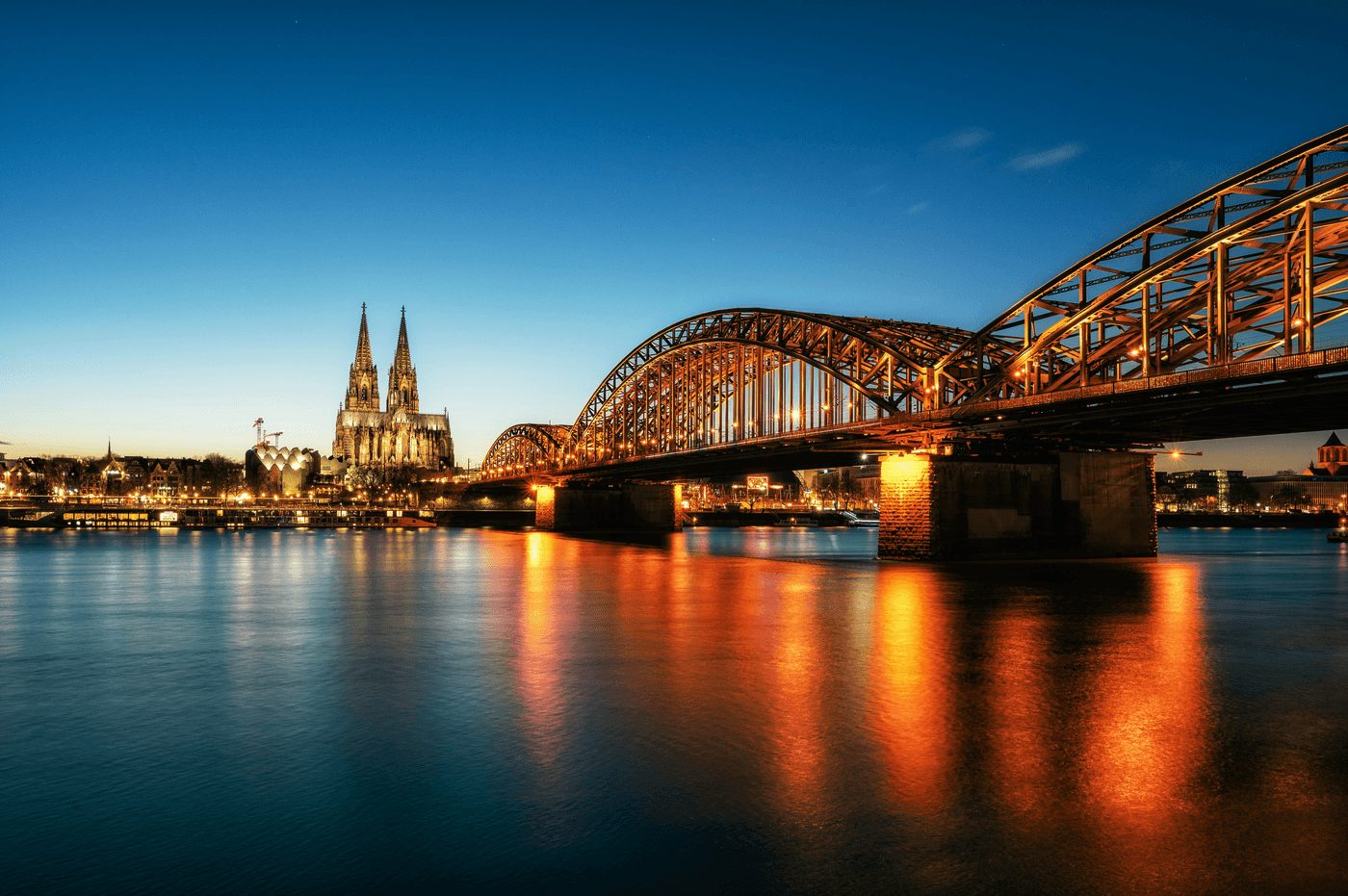 Cologne skyline and bridge at night